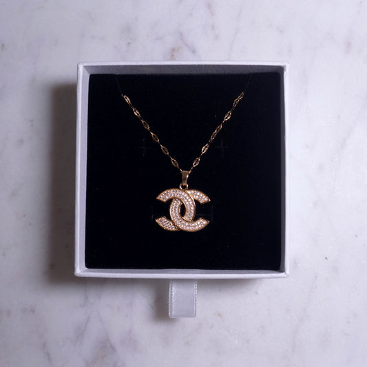 Cs gold twist necklace